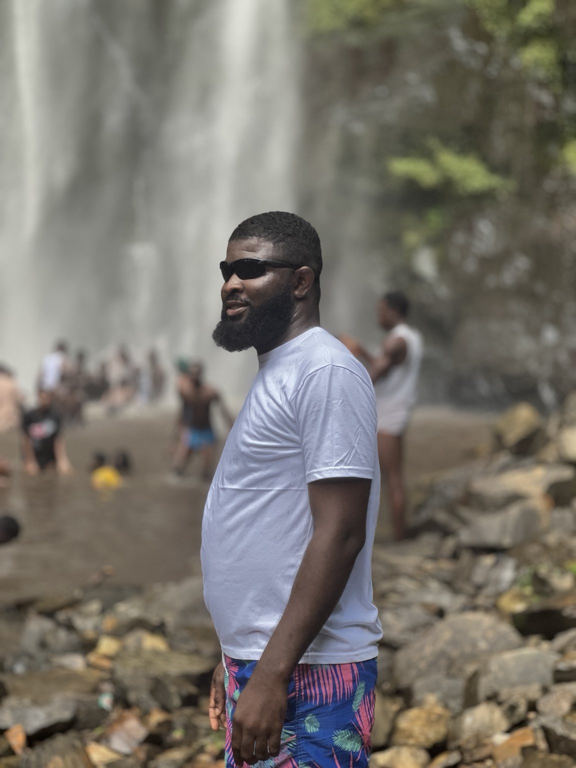 A VibeTrails guest at a waterfall